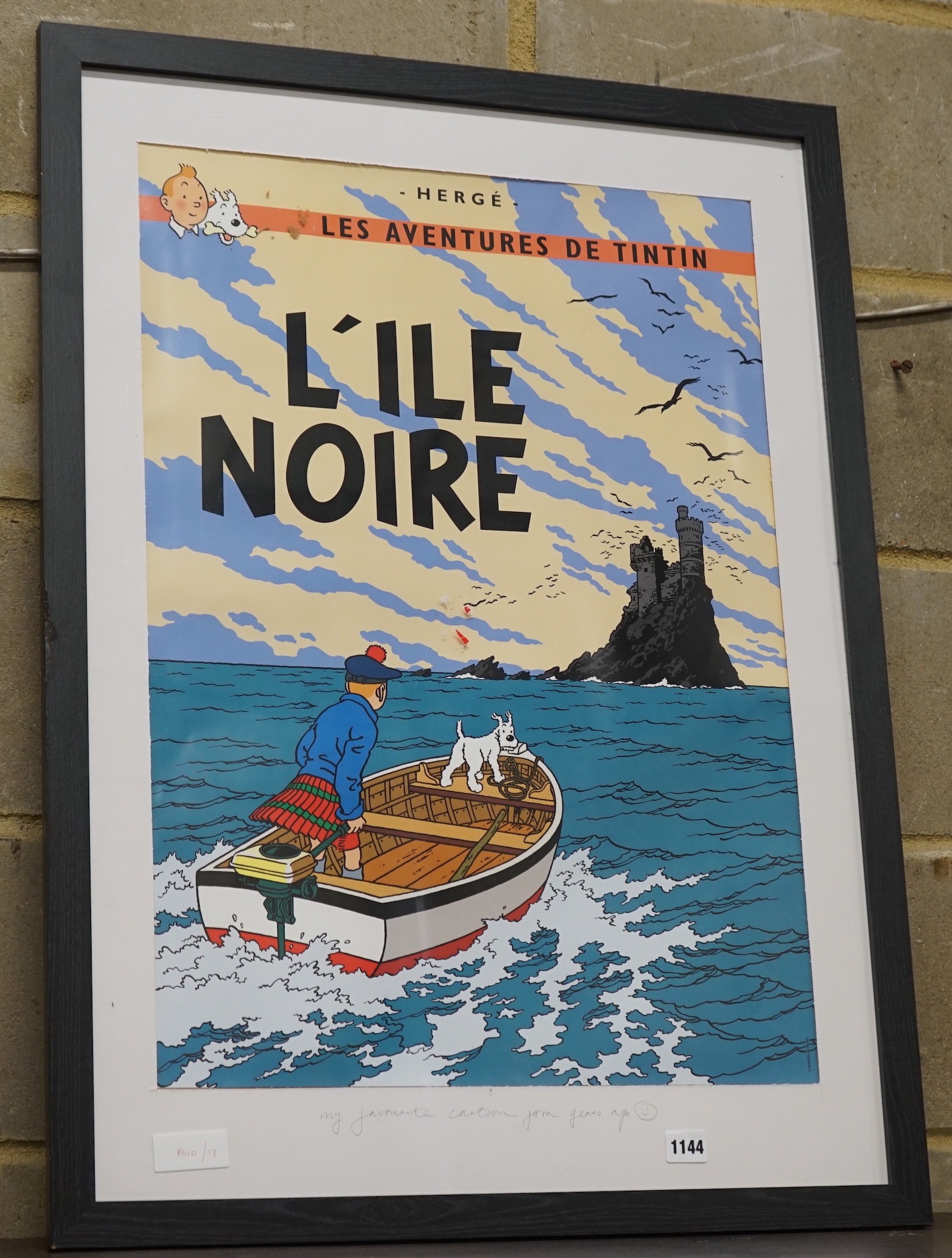 A reproduction Tin Tin poster, 'L'ile Noir', width 64cm, height 89cm including frame